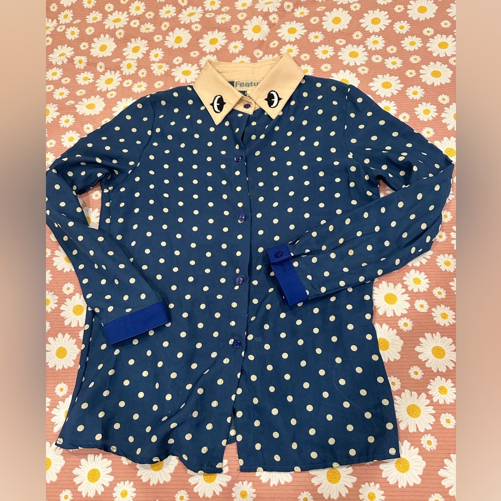 Feature cartoon eye polka dot button up.